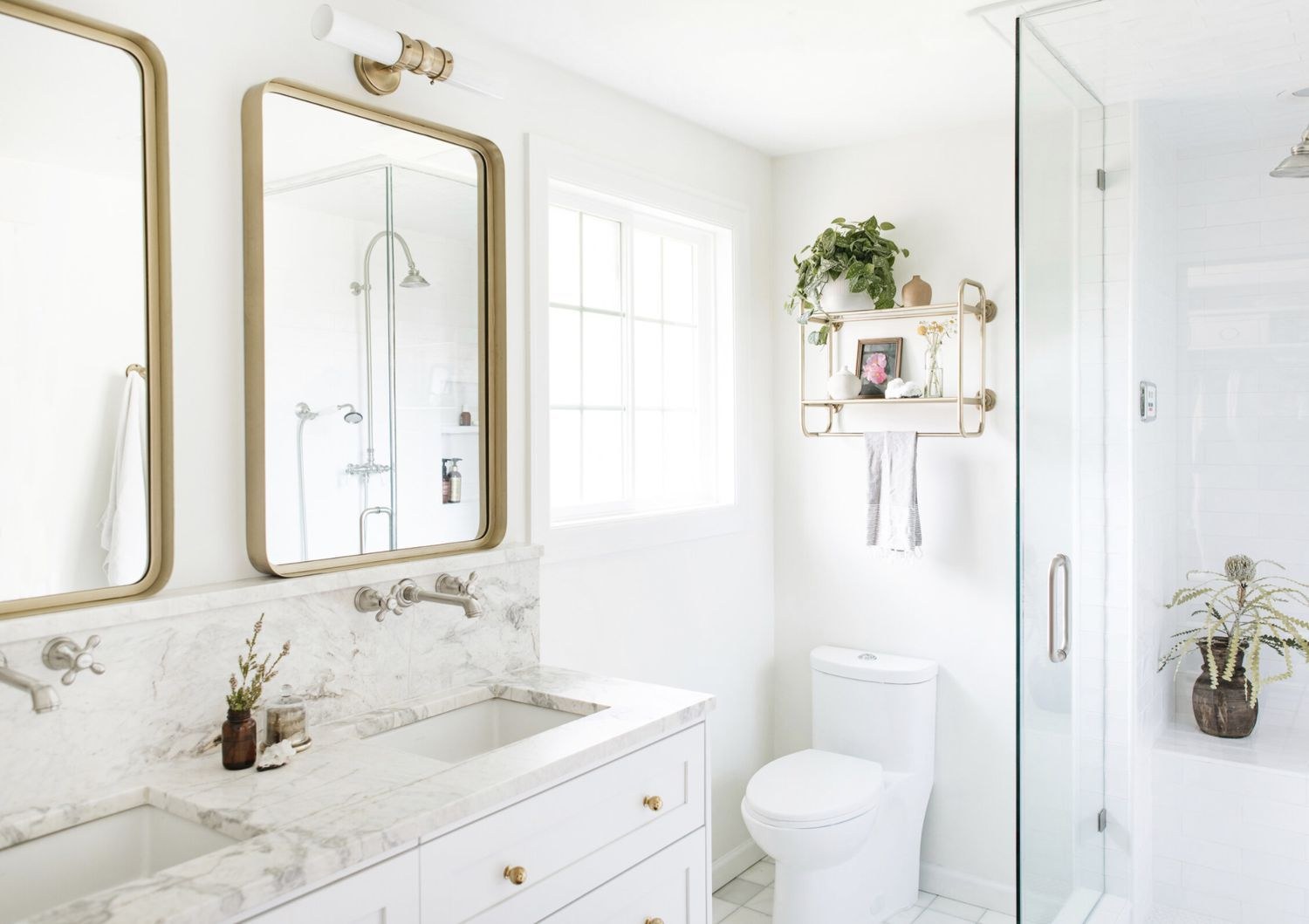 Luxury bathroom with marble, glass, and chrome fixtures
