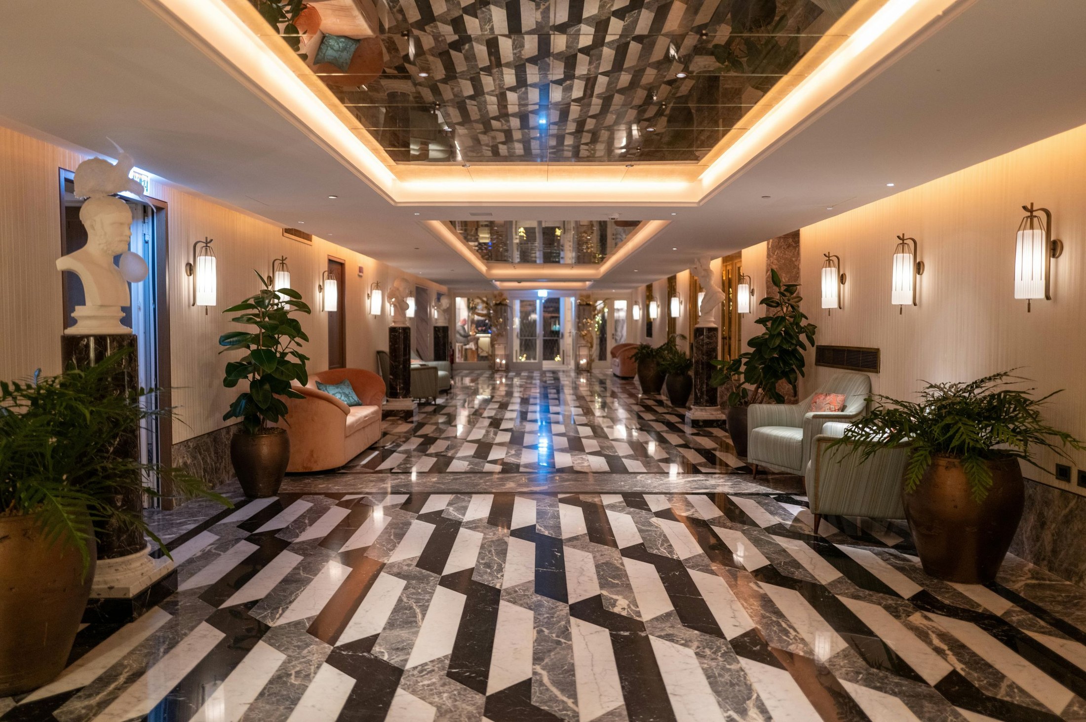 Luxury hotel lobby with marble and chandelier lighting